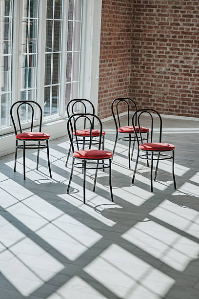 istock Empty chairs arranged on the dance floor in a cabaret rehearsal space 2246436424