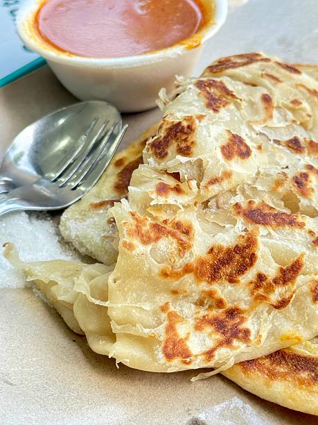 Roti Pratas or Roti cannai with dipping curry sauce