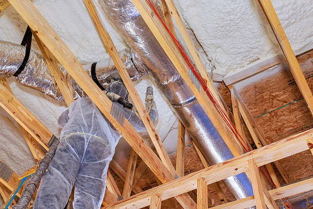 istock Construction worker installing ductwork in new residential modern home 2246436978