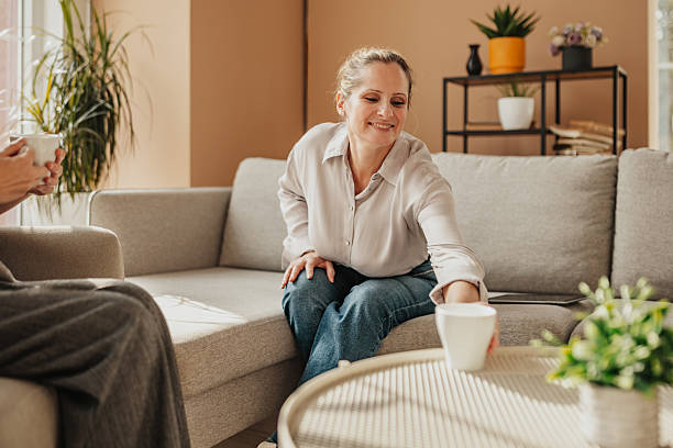 istock Businesswoman engages in planning session while enjoying coffee in a modern office setting with natural light 2246437549
