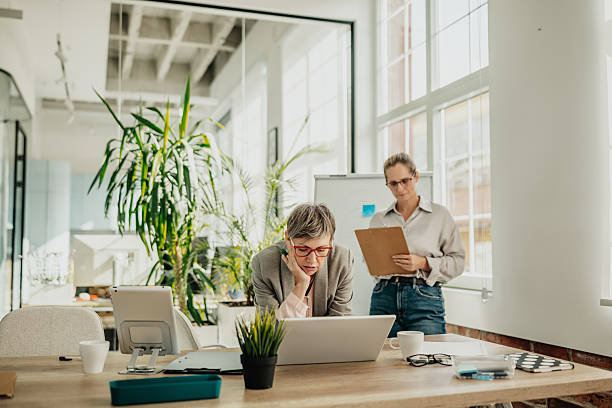 istock Businesswomen collaborating in a modern office setting while planning strategies for success 2246440316