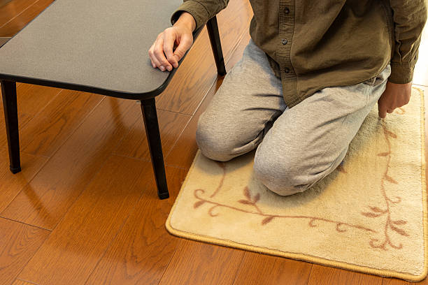 istock A person sitting on a carpet on the floor 2246440417