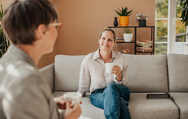 istock Businesswomen collaborating in a modern office space while enjoying coffee and discussing ideas 2246440535