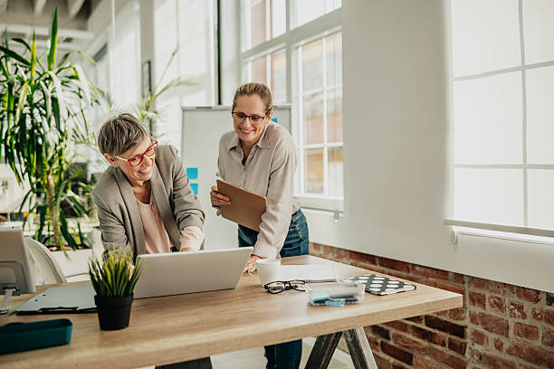 istock Businesswomen collaborating in a modern office space while planning for success 2246440580