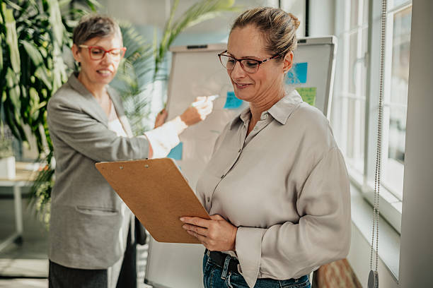 istock Businesswomen collaborating on project planning in a modern office setting with a focus on teamwork and success 2246440972