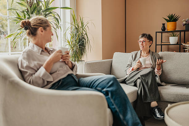 istock Businesswomen engage in productive conversation in a modern office setting during daytime 2246441805