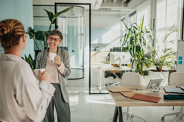 istock Businesswomen engaging in teamwork and planning activities in a modern office space during the day 2246442193