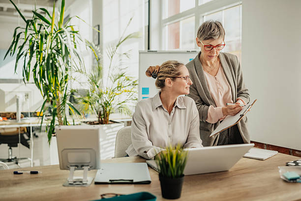 istock Collaboration between businesswomen in a modern office setting focusing on teamwork and planning activities 2246442484