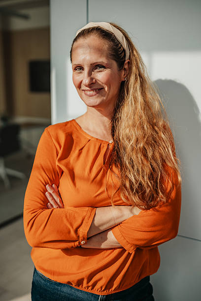 istock Confident businesswoman smiling in modern office during daytime 2246442589