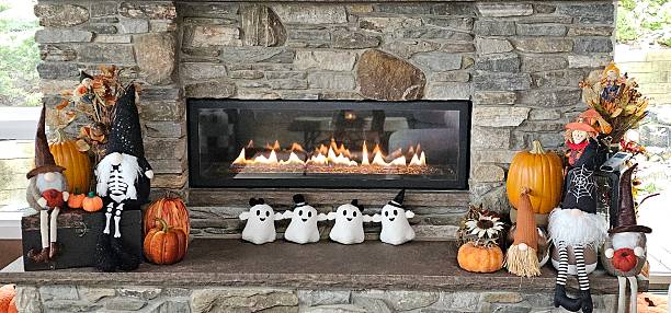 istock Halloween Decor in Front of a Large Stone Fireplace, Glowing with Cozy Flames 2246442876