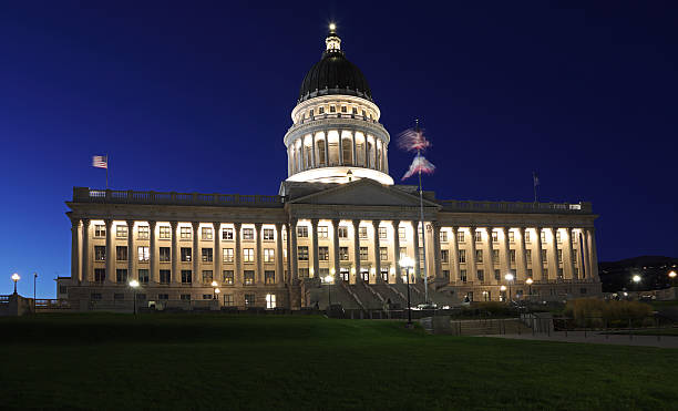 istock Utah State Capitol illuminated at dusk with green grass on the foreground 2246446443