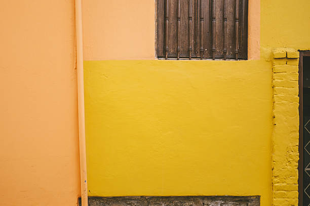 Orange and yellow facades in downtown Bogota, specifically in La Candelaria