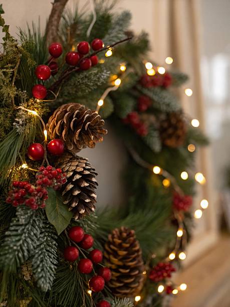 Christmas wreath with pine cones, berries and garland