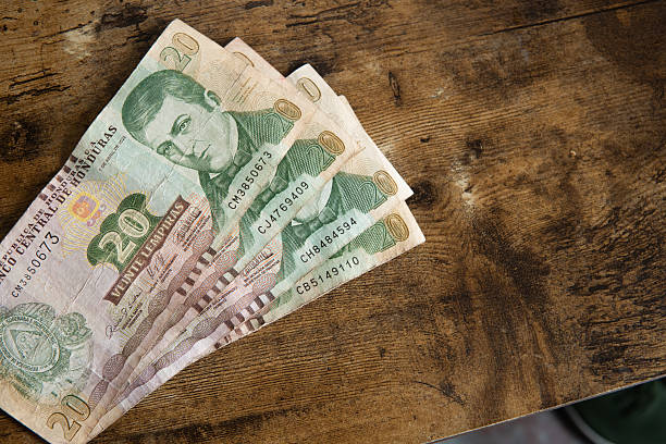 istock Honduran lempira banknotes on rustic wooden table 2246457255
