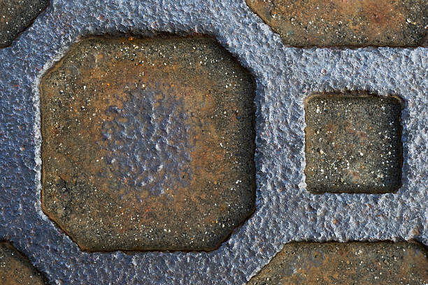 istock The geometric patterns on a rusted old manhole cover 2246457286