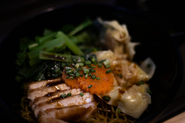Dry Noodles With Red Pork In Bowl, A savory ad photo of dry noodles with red pork in bowl, glossy meat a top springy strands, perfect for a noodle lover campaign or a bold flavor documentary still.