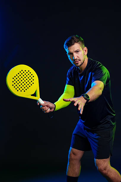 istock Player preparing for a shot in a dynamic padel match indoors 2246459696