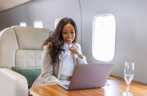 istock Businesswoman working on laptop during private jet flight 2246462707