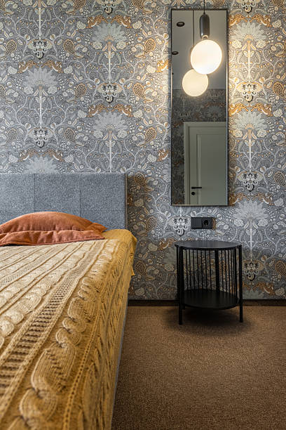 istock Modern Bedroom Detail with Bedside Table and Lamp Reflection 2246462772