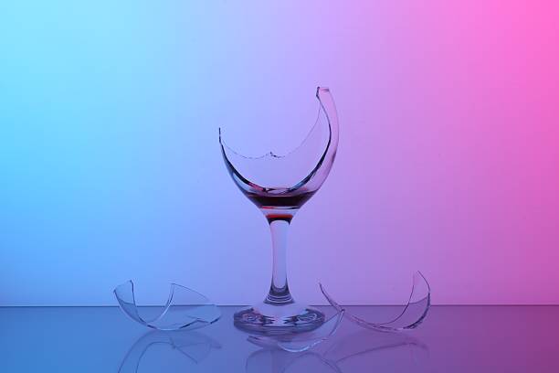 istock Pieces of broken glass with wine on table, color tone effect 2246463382