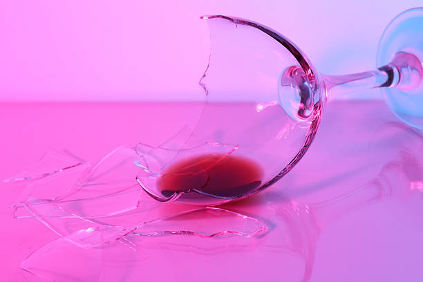 istock Pieces of broken glass with wine on table, closeup. Color tone effect 2246463396