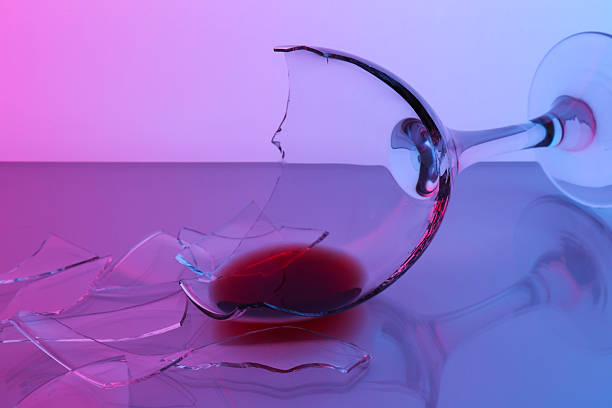 istock Pieces of broken glass with wine on table, closeup. Color tone effect 2246463397