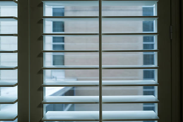 Window in cozy room in european house with sunshades  and vintage interior