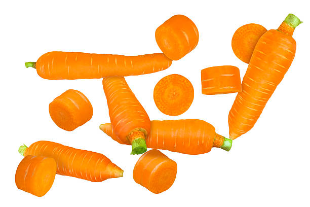 istock Scattered fresh whole and sliced ​​carrots. 2246465633