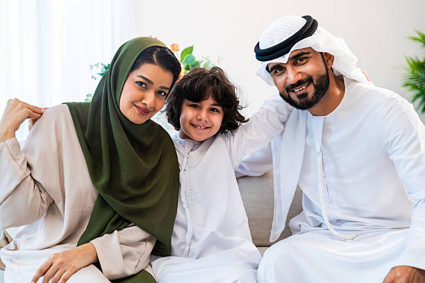 istock Arab family with son embracing at home 2246468023