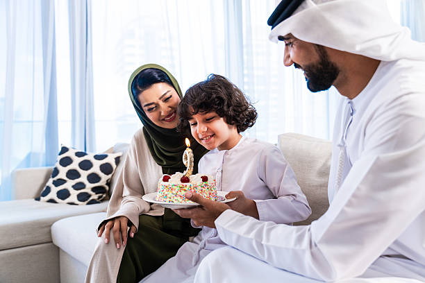 istock Arab family celebrating son's birthday at home 2246468310