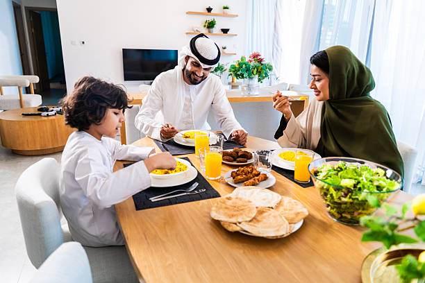 istock Middle eastern family enjoying meal together at home 2246468357