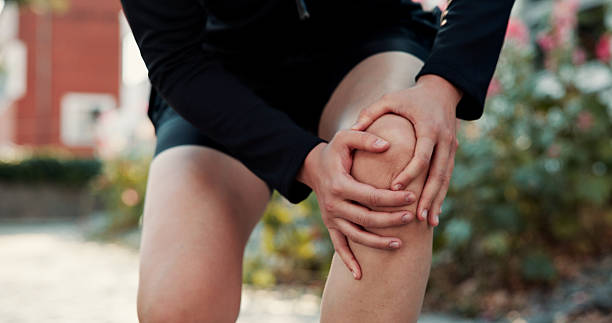 istock Legs, man outdoor and knee pain with workout challenge, difficult exercise and medical emergency. Person, hands and athlete with joint inflammation from sports injury, strain and lack of stretching. 2246468375