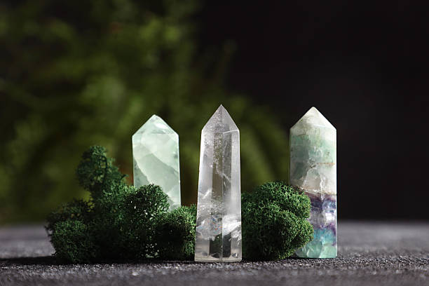 istock Natural gemstones and moss on grey textured table, closeup 2246471294