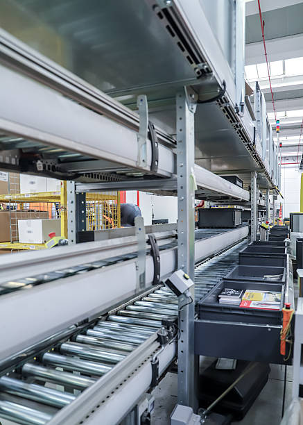 istock packing line in a logistics warehouse. conveyor belt in a modern production line 2246471622