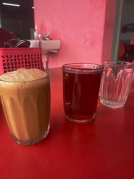 istock Teh Tarik, Teh O, and Plain Water on Red Table 2246471637