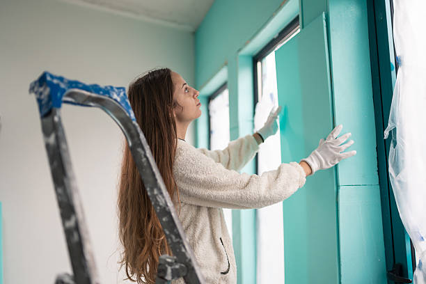 istock Happy woman finishing insulation project 2246473987