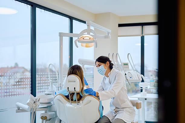 istock Female dentist examining patient during dental check-up 2246474055