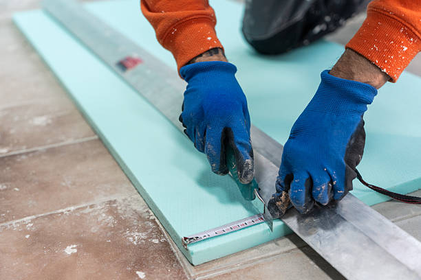 istock Professional man trimming XPS foam insulation indoors 2246474456