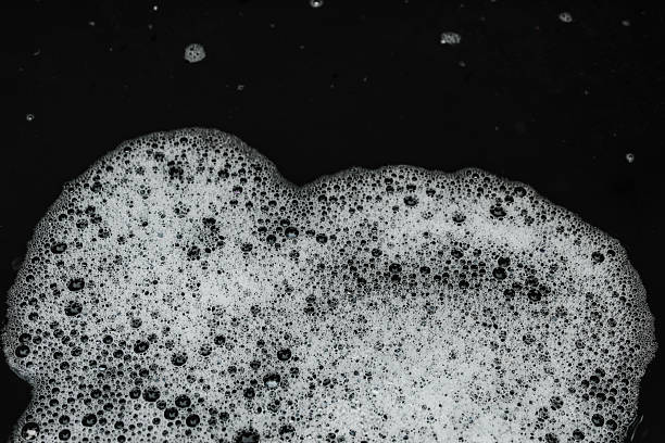 istock white soap foam texture with small and large air bubbles spread across the surface of the water 2246474902