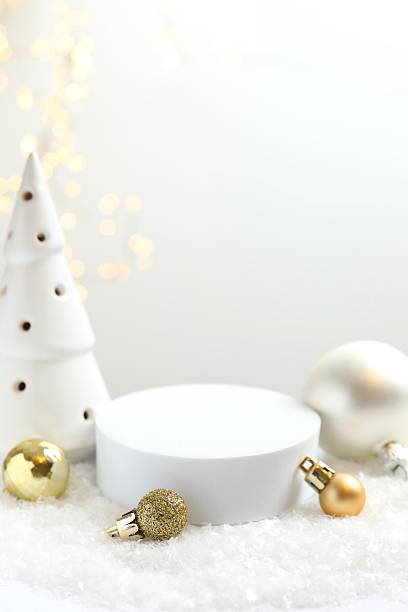 istock Christmas concept. White podium, decor, white snow and bokeh lights 2246475254