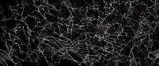 istock The pattern on the glass is cracked.  damage to the glass.  cracked texture 2246475720