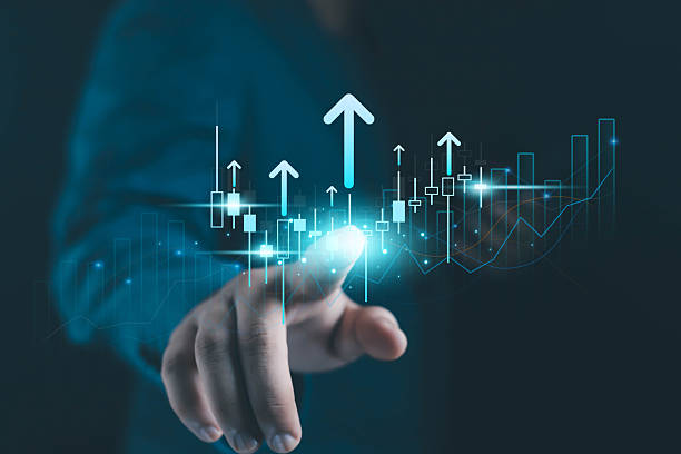 istock Business hand touching digital financial growth chart with rising arrows, candlestick data, and futuristic analytics interface representing market trends, investment strategy, and economic success. 2246476166