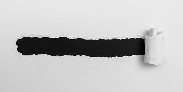 istock Tear open the white paper on the black paper 2246478808