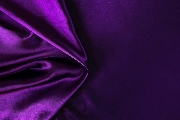 istock purple silk background cloth fabric. silk fabric background. Copy space. 2246479011