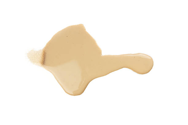 istock Spilled chocolate milk puddle isolated on white background 2246479356