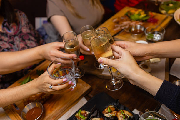 istock Clinking glasses with alcohol and toasting, party. 2246480594