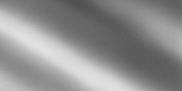 istock Monochrome abstract texture simulating brushed or polished metal surface with strong diagonal light reflection. 2246481434