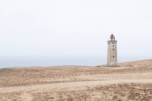 Rubjerg Knude lighthouse on a foggy day.