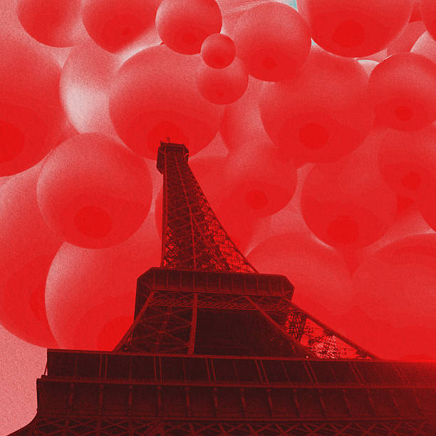 istock Eiffel tower against surreal spherical shapes pink sky 2246481676
