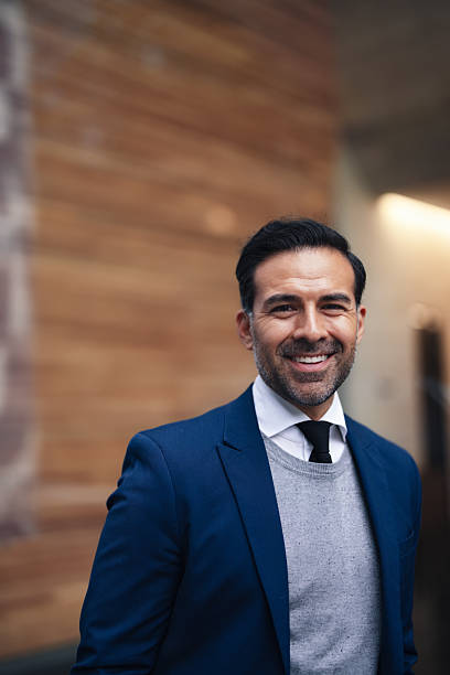 istock Confident Businessman In Blue Suit Smiling Outdoors In Urban Setting 2246482479